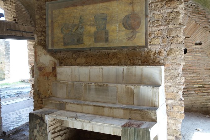 Ancient Ostia Antica Semi-Private Day Trip from Rome by Train with Guide - The Baths of Neptune and their remarkable mosaic