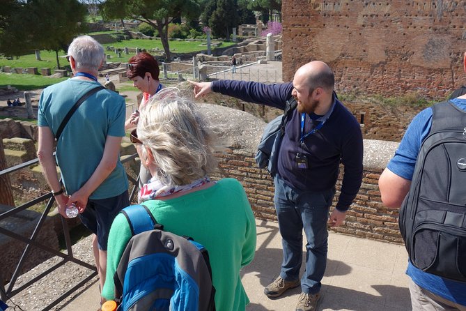 Ancient Ostia Antica Semi-Private Day Trip from Rome by Train with Guide - Sitting in the ancient amphitheater