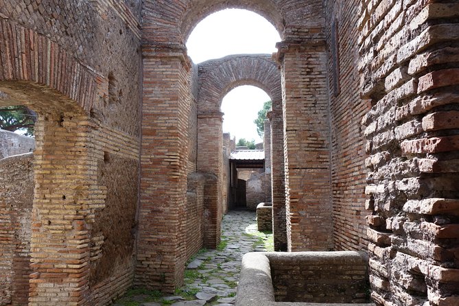Ancient Ostia Antica Semi-Private Day Trip from Rome by Train with Guide - Shops, apartments, taverns, and the Forum of the Corporations
