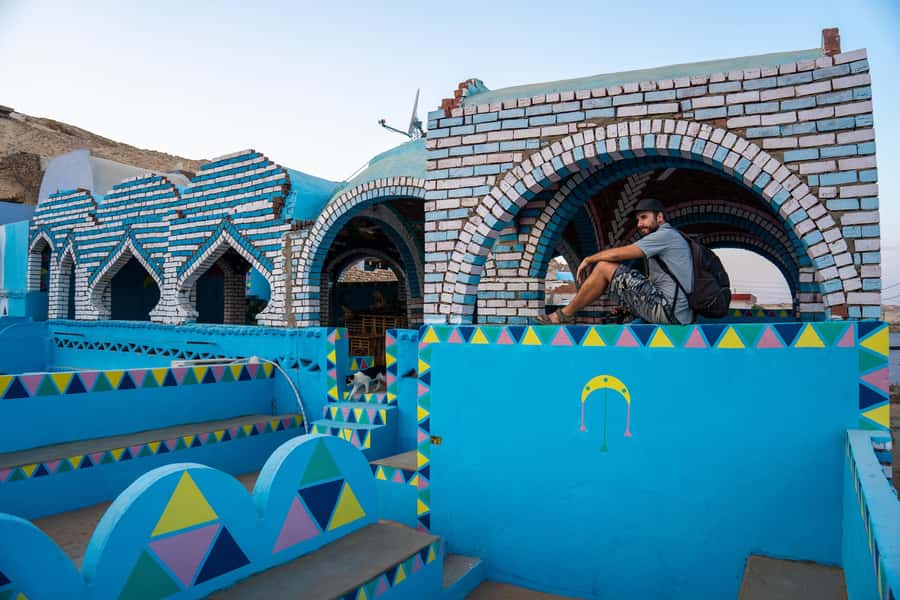 Aswan: Nubian Village Day Trip with Camel Ride - Riding a camel through colorful village streets