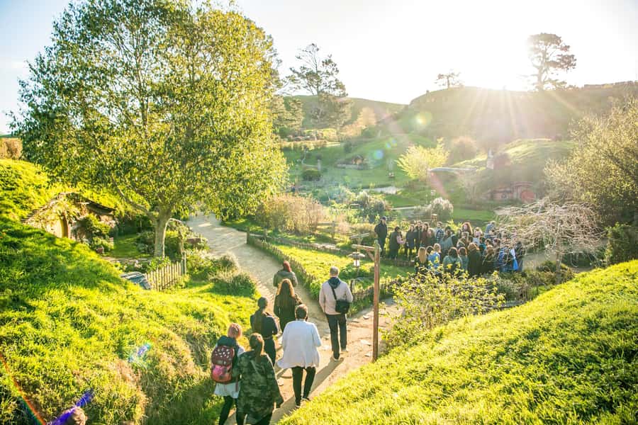 Auckland: Hobbiton Movie Set Day Trip with Festive Lunch - Walking through the Shire