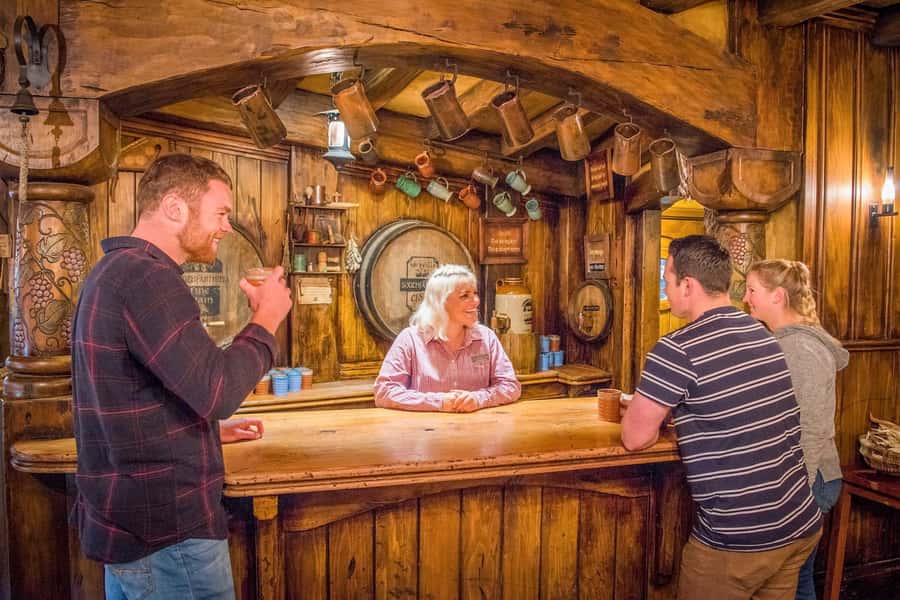 Auckland: Hobbiton Movie Set Day Trip with Festive Lunch - A drink at the Green Dragon Inn