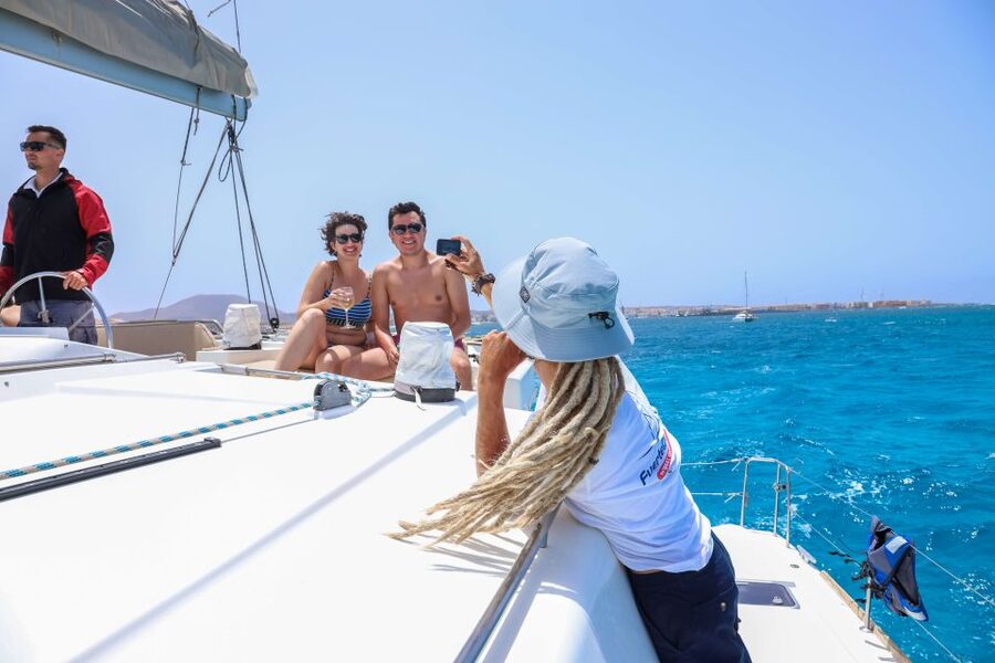 Corralejo: Adults-Only Catamaran Day Trip to Lobos Island - The crew makes the small boat work