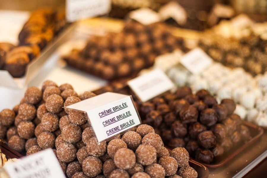 From Amsterdam: Bruges Day Trip in English with Boat Option - Chocolate, lace, beer, and lunch costs