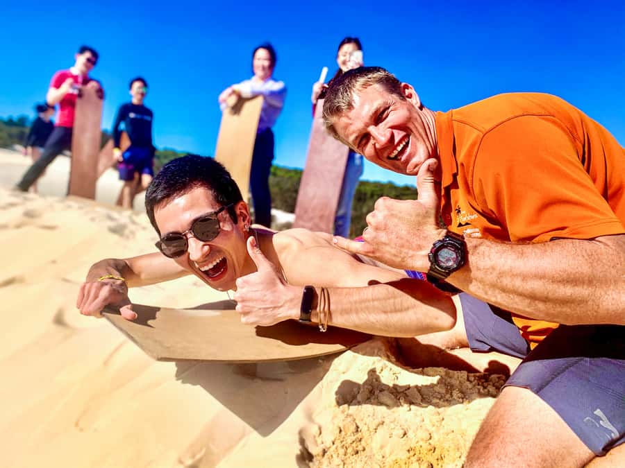 From Brisbane: Moreton Island Full-Day Trip - Sand tobogganing at The Desert