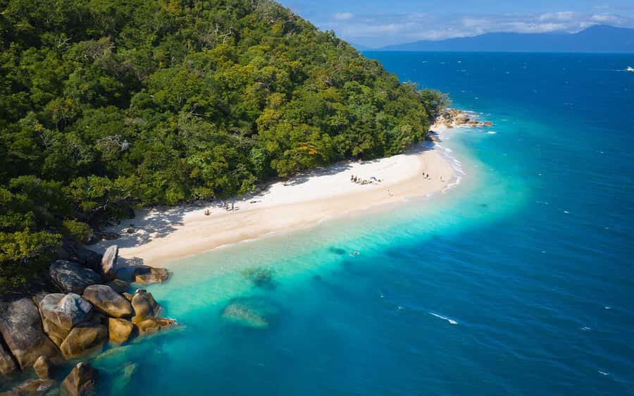 From Cairns: Fitzroy Island Day Trip by Ferry - Welcome Bay is the natural center of the day
