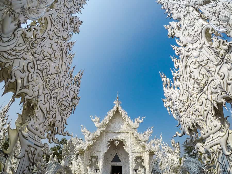 From Chiang Mai: White Temple & Golden Triangle Day Trip - Chiang Saen and Wat Chedi Luang add historical depth