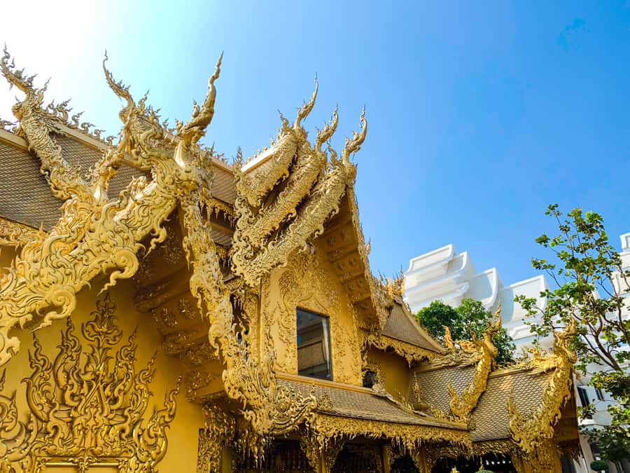 From Chiang Mai: White Temple & Golden Triangle Day Trip - The House of Opium explains a difficult past