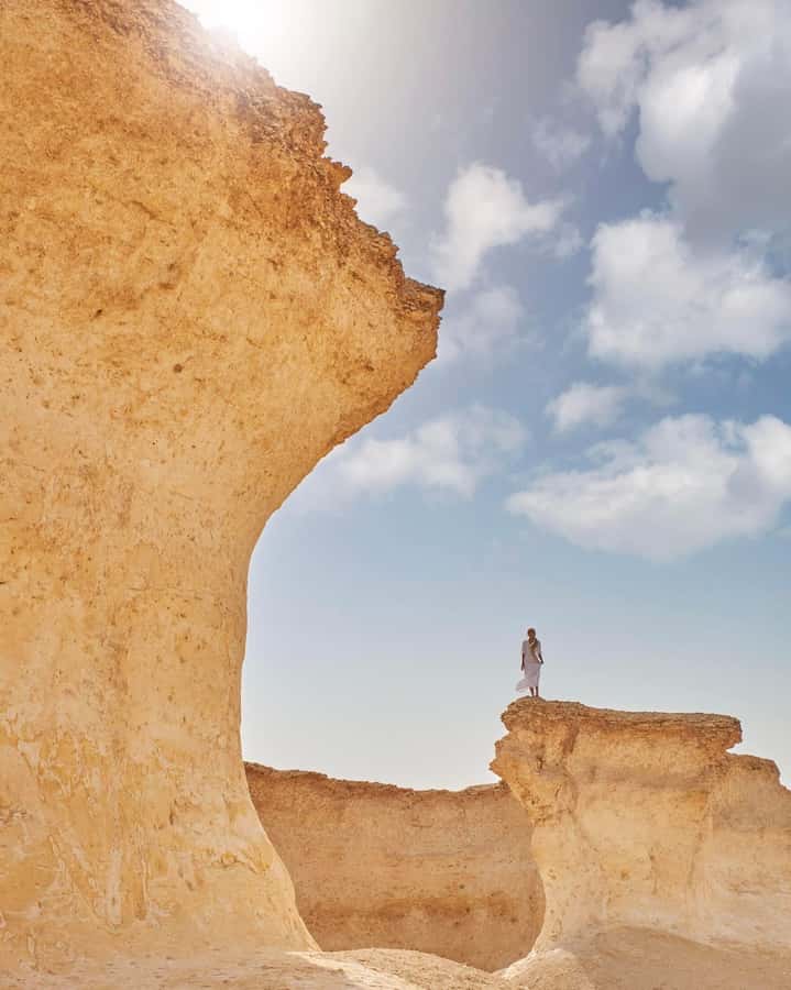 From Doha: Day Trip to North And West Qatar With Pickup - Zekreet’s rock formations and the umbrella-shaped stone