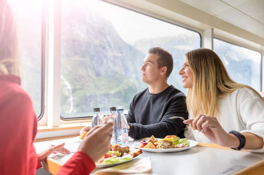 From Queenstown: Milford Sound Day Trip on Premium Coach - Lunch, deck time, and the best way to use the boat