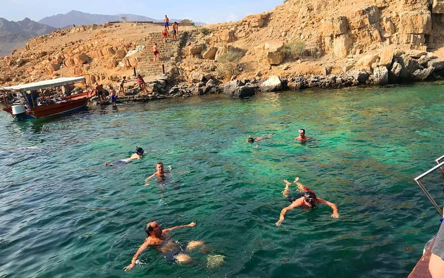 From Ras al Khaimah: Musandam Khasab Day Trip with Transfer - Boarding a traditional dhow in Khasab