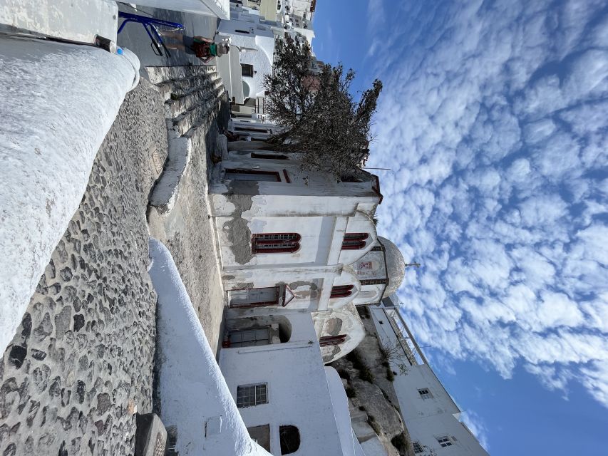 From Rethymno: Full-Day Trip to Santorini by Boat - Athinios port and the air-conditioned bus
