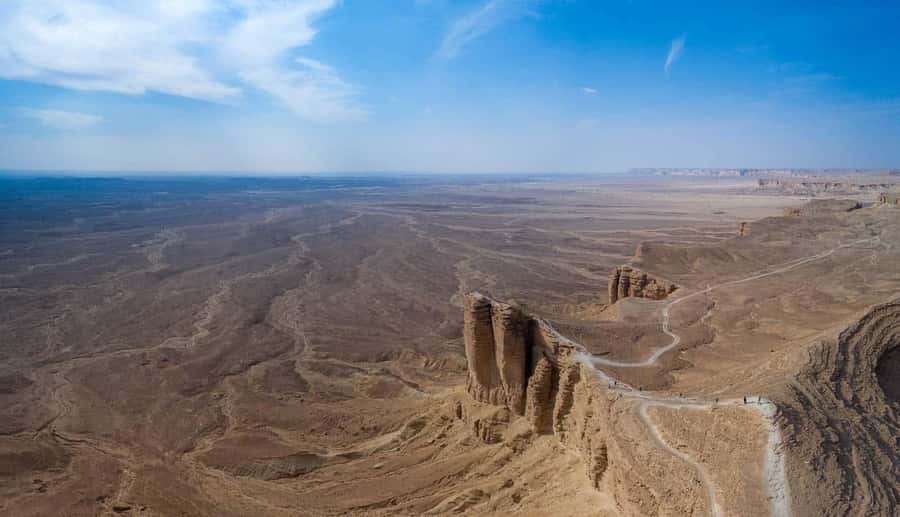 From Riyadh: Tuwaiq Mountains and Najd Plateau Day Trip - Blue Sky, Sunset, and Open Desert Views