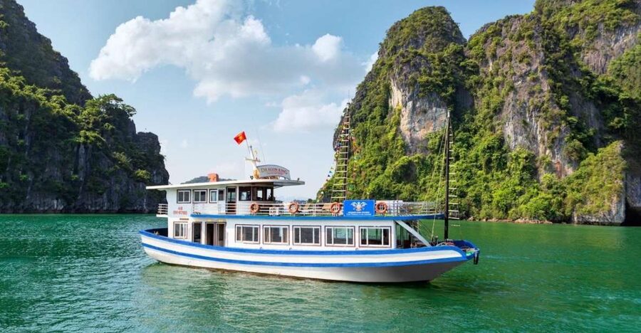 Hanoi: Halong Bay Day Trip with Titop Island, Cave, & Kayak - Boarding the boat and settling in for lunch