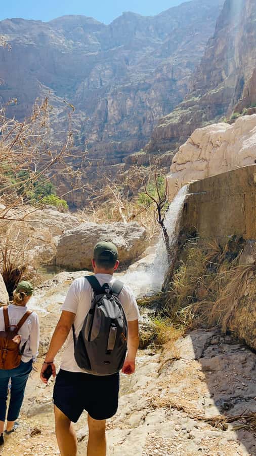 Muscat: Wadi Shab, Romantic Cave and Sinkhole Full-day Trip - The rocky walk rewards a steady pace