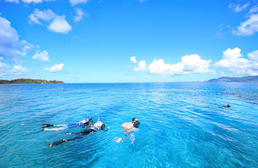 Naha, Okinawa: Keramas Island Snorkeling Day Trip with Lunch - First snorkeling site: coral, fish, and clear water
