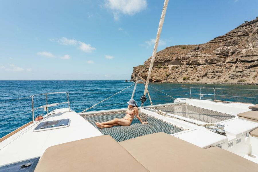 Santorini: Luxury Catamaran Day Trip with Meal and Open Bar - Red Beach and the first swim
