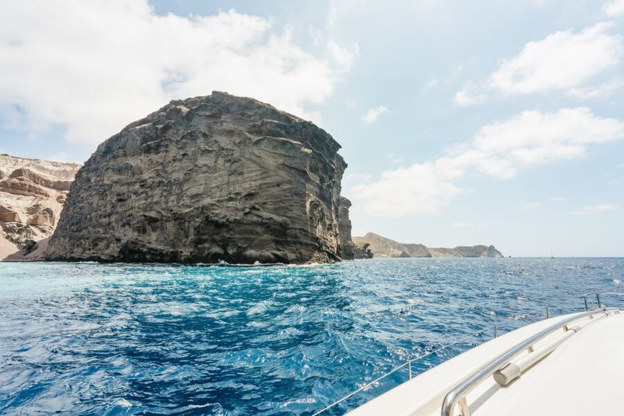 Santorini: Luxury Catamaran Day Trip with Meal and Open Bar - White Beach sea caves and volcanic scenery