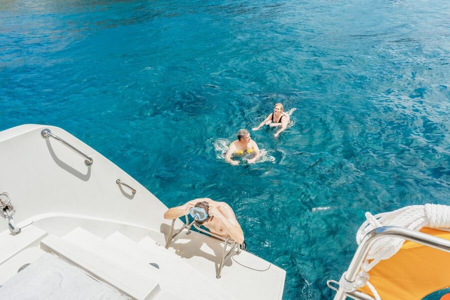 Santorini: Luxury Catamaran Day Trip with Meal and Open Bar - A Greek meal cooked on board