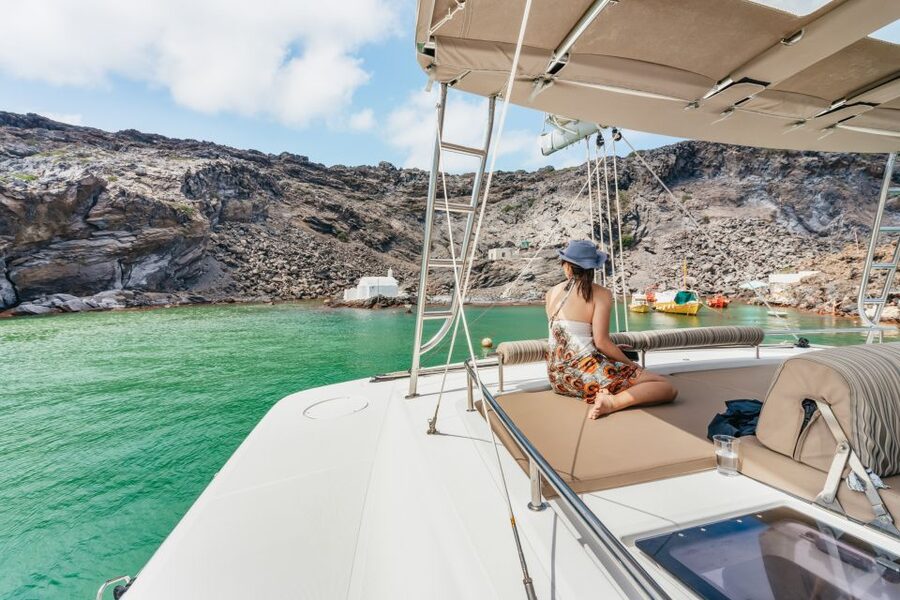 Santorini: Luxury Catamaran Day Trip with Meal and Open Bar - Open bar, music, and the feel of the boat
