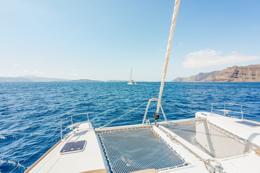 Santorini: Luxury Catamaran Day Trip with Meal and Open Bar - Hotel pickup and getting to the marina
