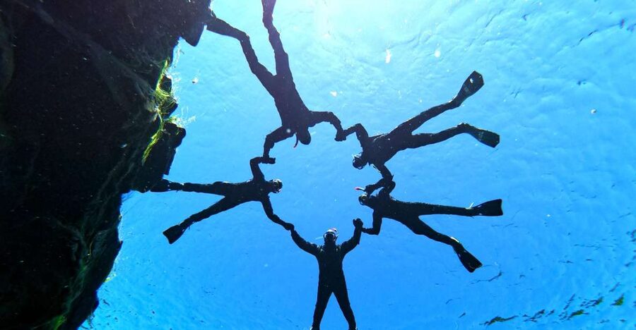 Silfra: Half-Day Snorkeling Day Trip with Underwater Photos - Getting into the drysuit takes patience