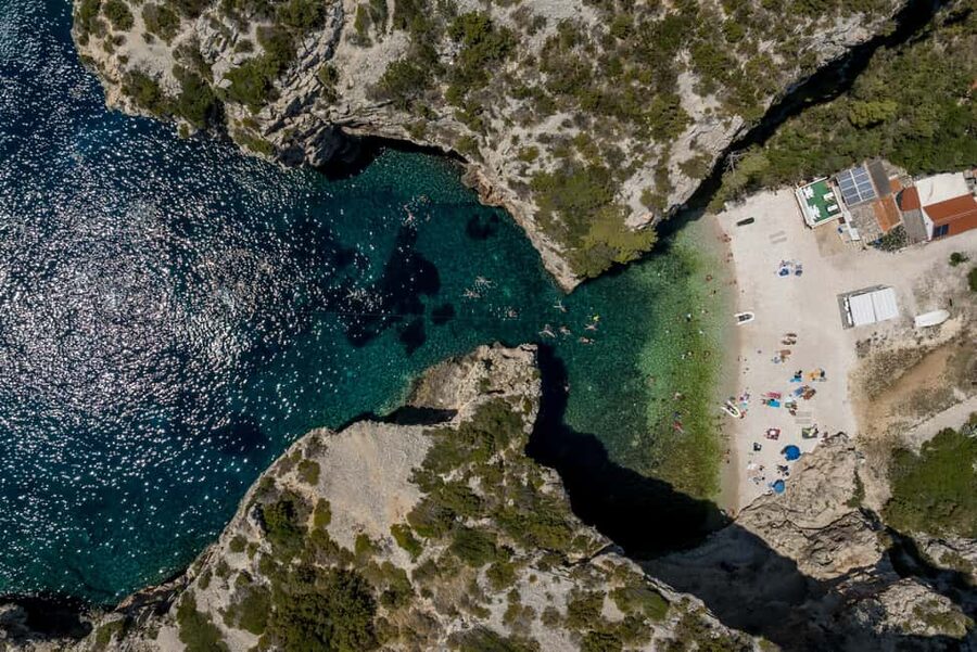 Split or Trogir: Blue Cave, Vis, and Hvar Speedboat Day Trip - Stiniva Cove from the water