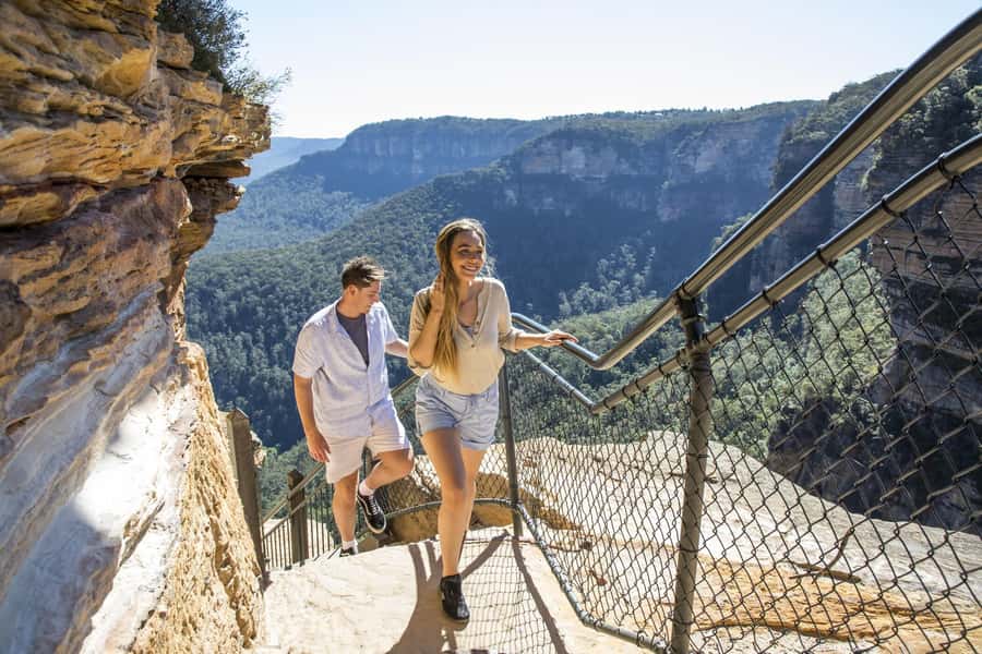 Sydney: Waterfall Bushwalk and Blue Mountain Sunset Day Trip - The Three Sisters at golden hour