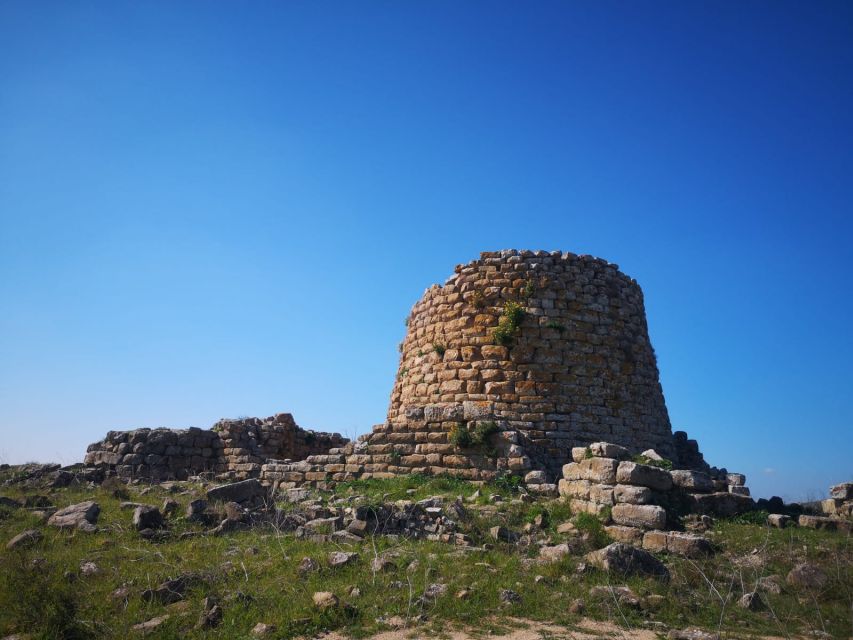 The Nuraghe Tour: Day Trip from Cagliari - Walking into a three-lobed nuraghe